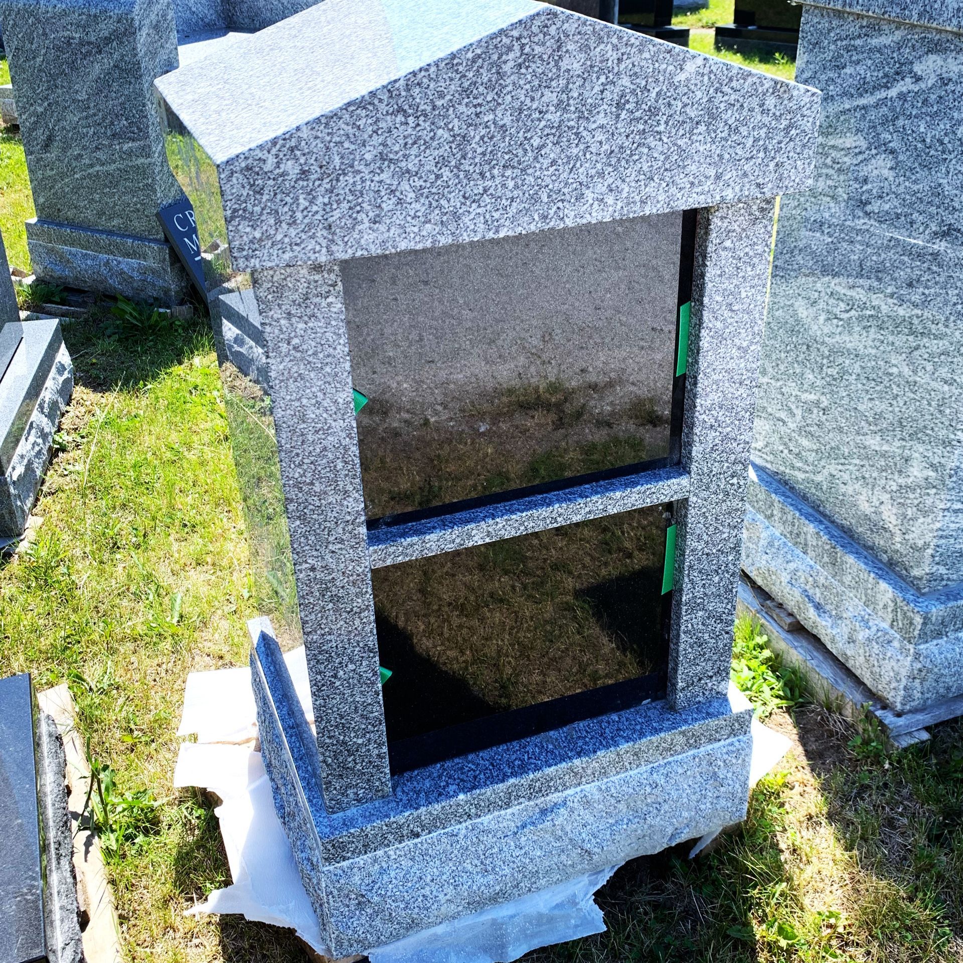 a vertical cremation monument at Champlain Monuments