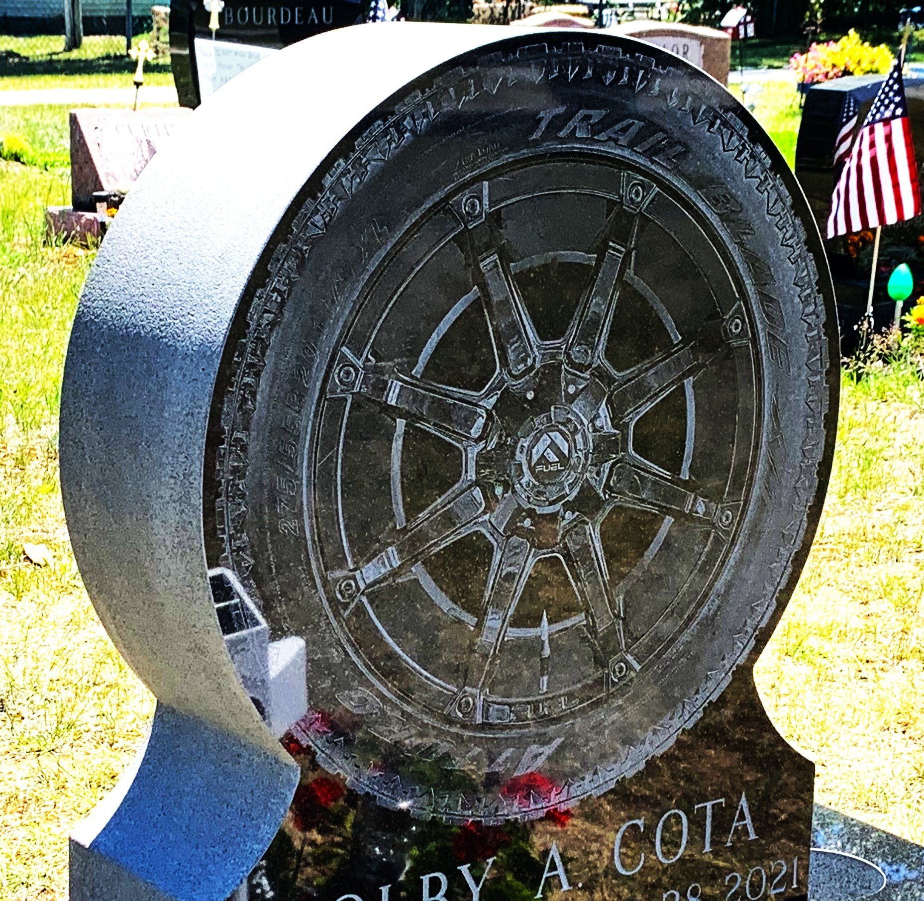 Custom black granite etching memorial by Champlain Monuments