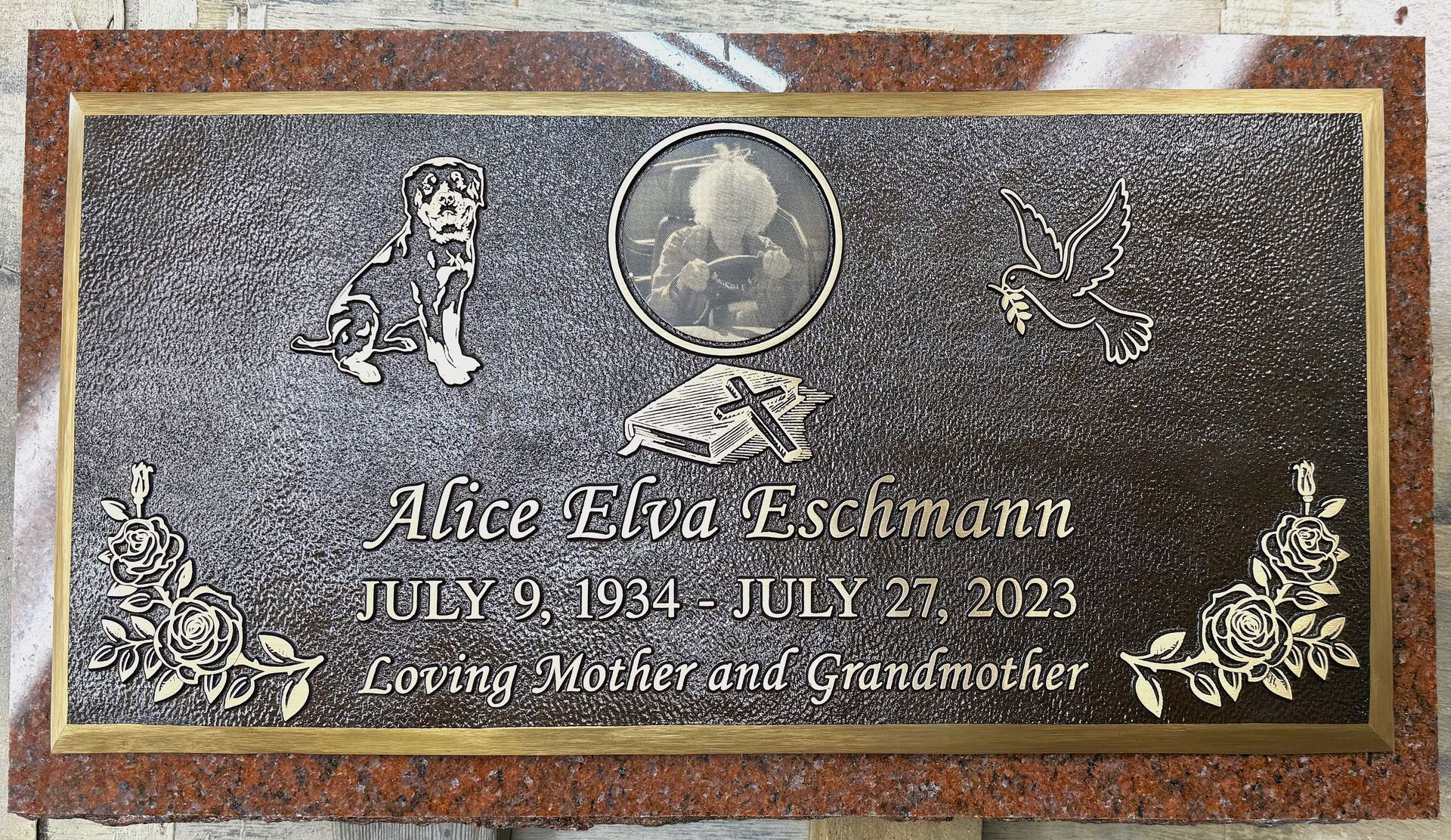 A custom bronze marker installed on a granite backer.