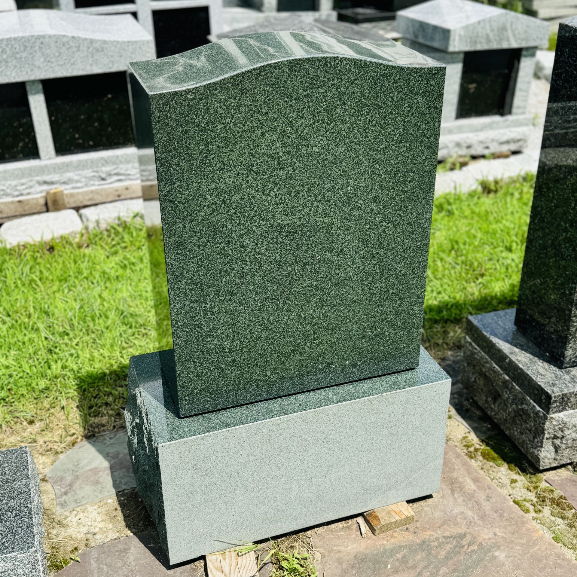 Green granite monument at Champlain Monuments