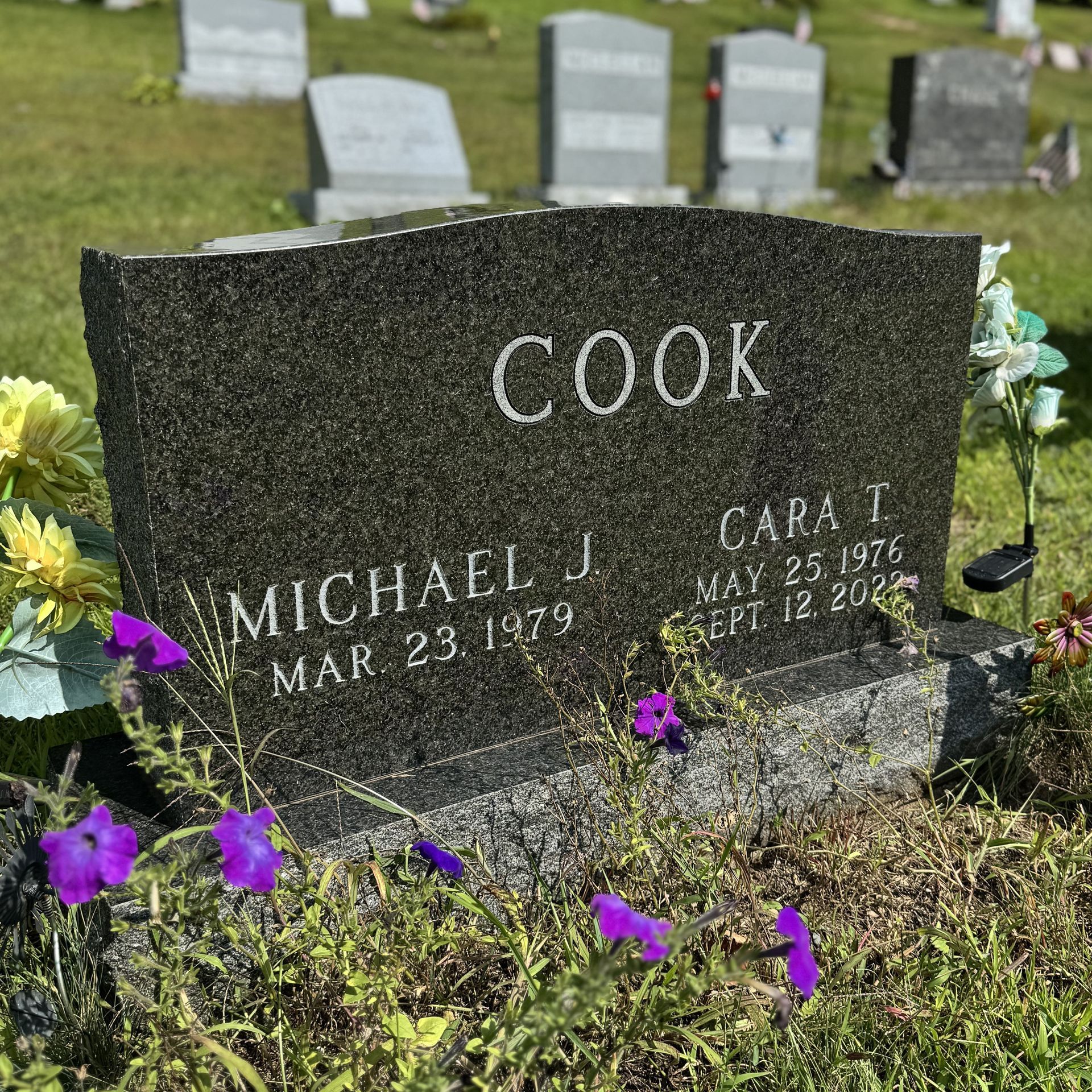 Custom headstone from Champlain Monuments.