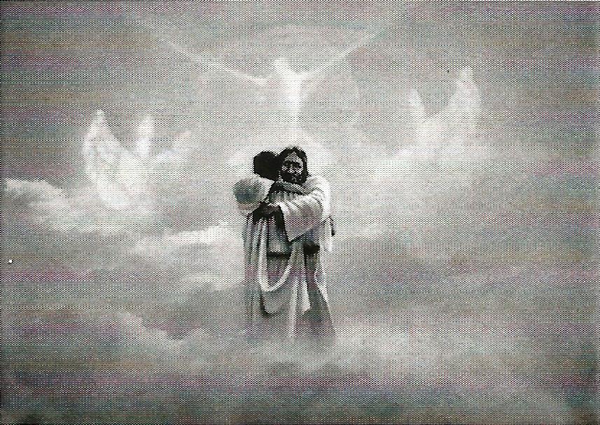 a black and white photo of jesus holding a child in his arms .