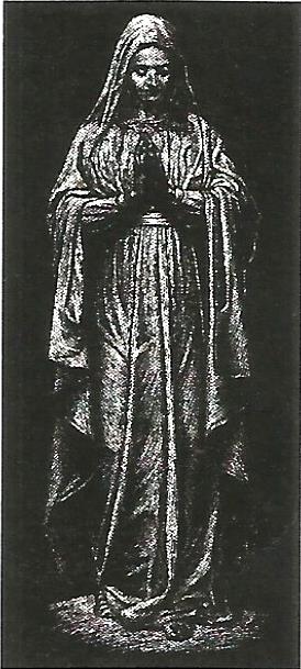 a black and white photo of a statue of a woman holding a cane .