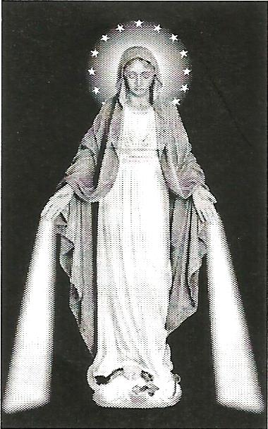 a black and white photo of a statue of the virgin mary