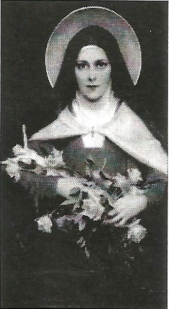 a black and white photo of a woman holding a cross and flowers .