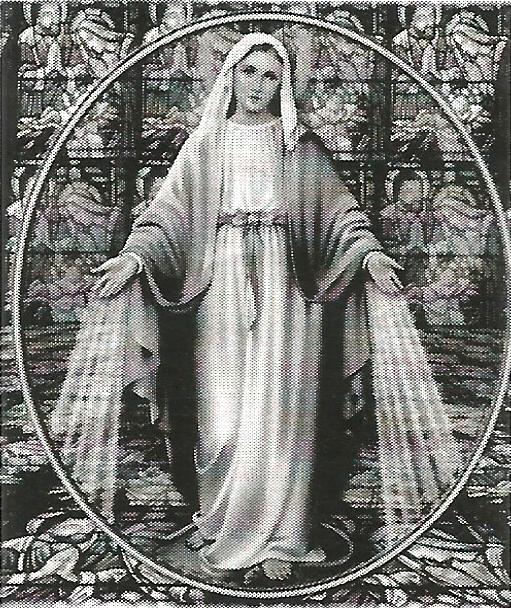 a black and white photo of the virgin mary in front of a stained glass window .