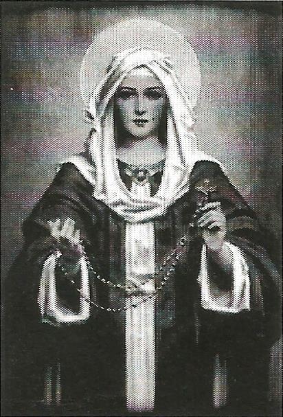 a black and white photo of a woman holding a rosary