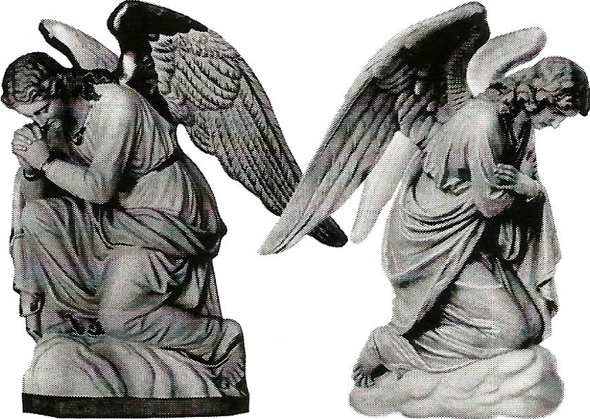 a black and white photo of two angels praying