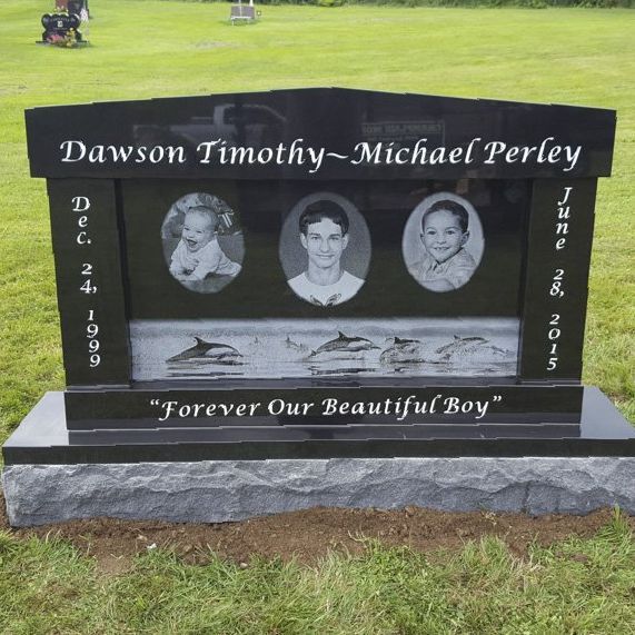 a black cremation monument installed by Champlain Monuments