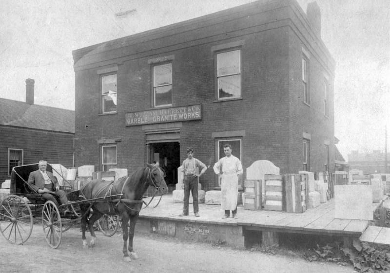William Barrett in front of his granite & marble working business on Federal St. in Saint Albans, VT