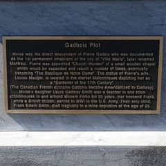 A bronze plaque mounted on a monument