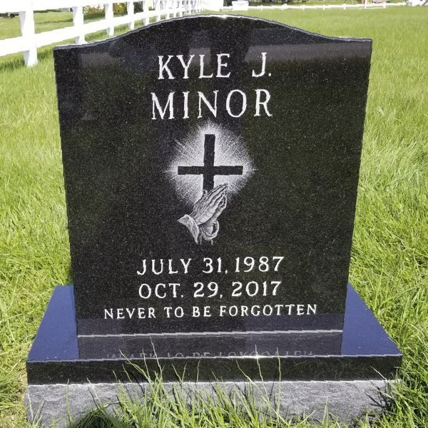 a small black headstone for an affordable price