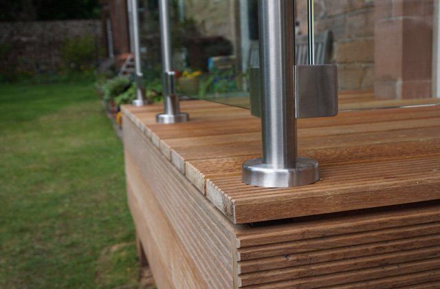 Solid Balau Decking topped with Frameless stainless steel and Glass balustrade for a touch of sophistication in the garden example 4