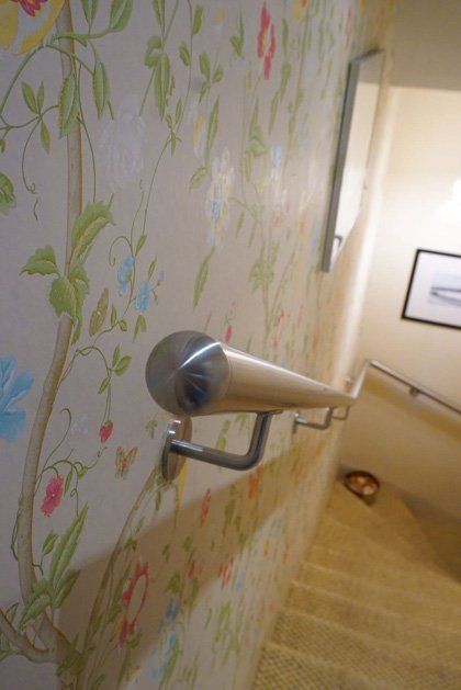 A last minute stainless steel handrail custom made and fitted to provide safe access to a basement flat example 2