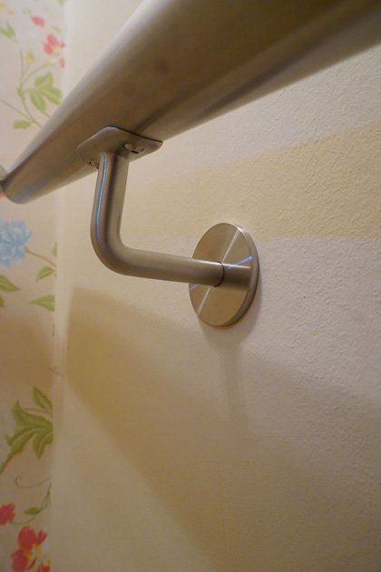 A last minute stainless steel handrail custom made and fitted to provide safe access to a basement flat example 5