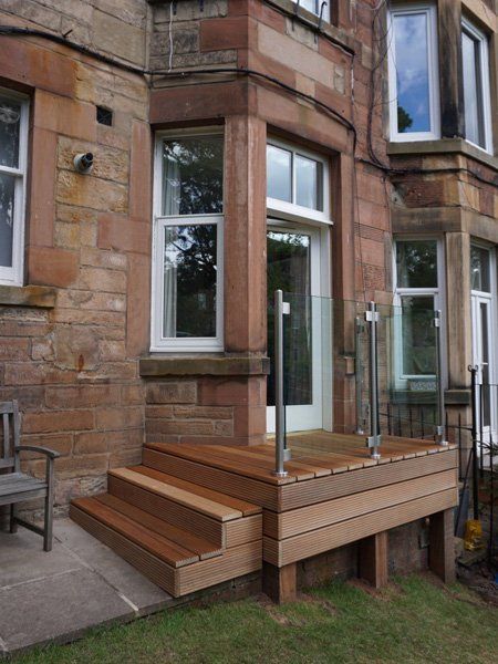 Solid Balau Decking topped with Frameless stainless steel and Glass balustrade for a touch of sophistication in the garden example 2