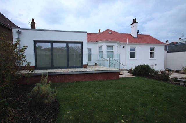 Glass bolted directly to the face of the new decking