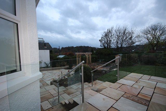 Glass bolted directly to the face of the new decking