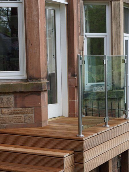 Solid Balau Decking topped with Frameless stainless steel and Glass balustrade for a touch of sophistication in the garden example 1