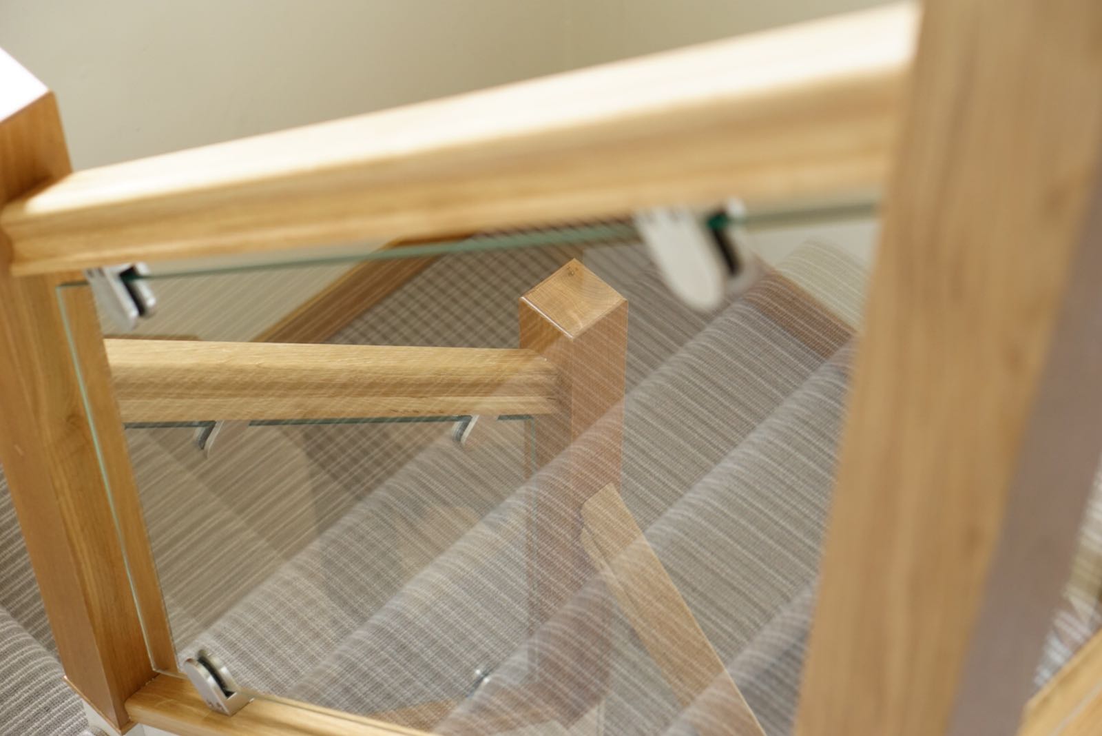 Dated staircase brought bang up to date with oak and polished glass example 4