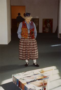 Louise Tester looking over her painting