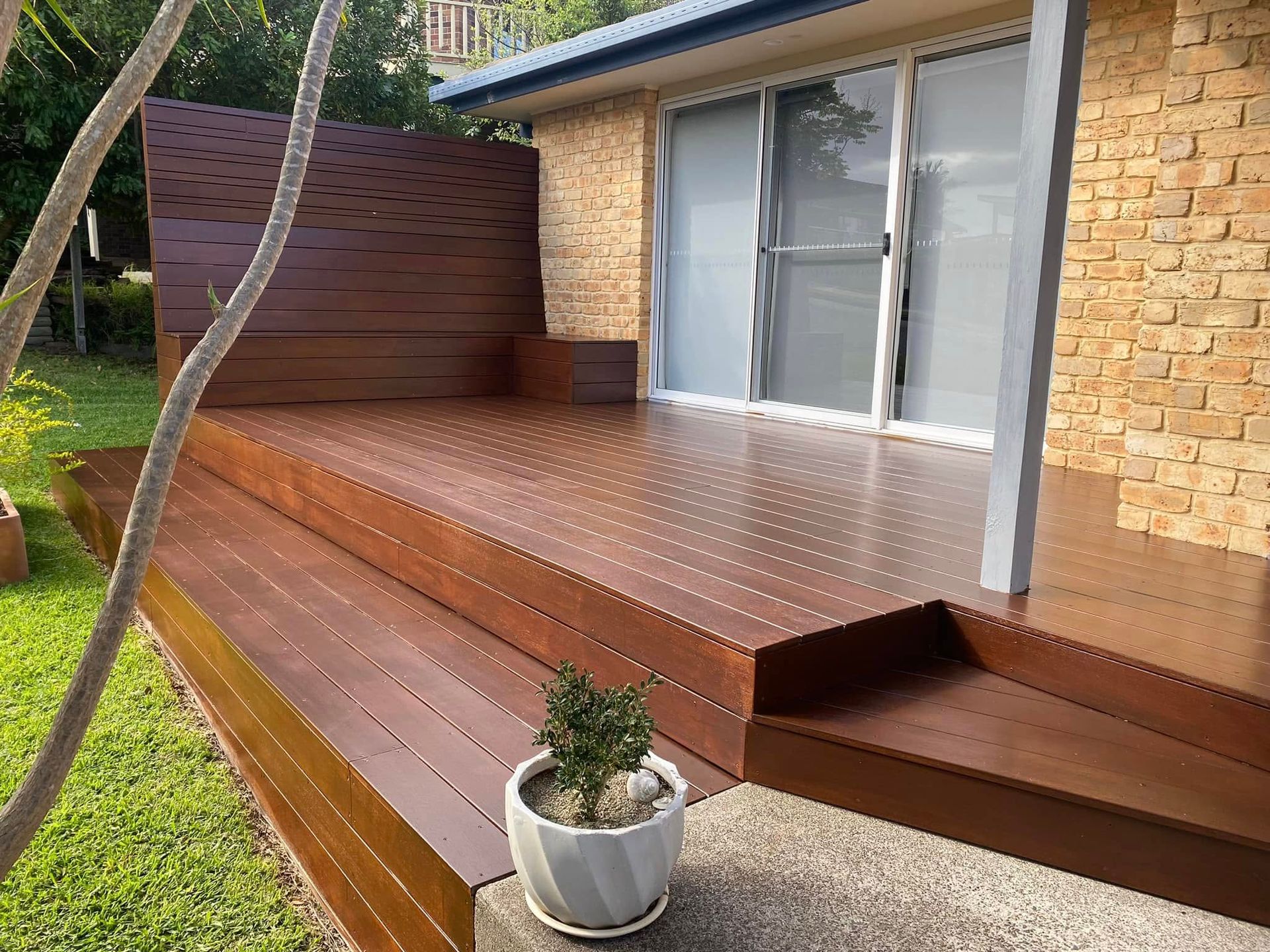 Wooden Deck With Steps, Bench, and Sliding Glass Door — Barrington Coast Homes in Forster, NSW