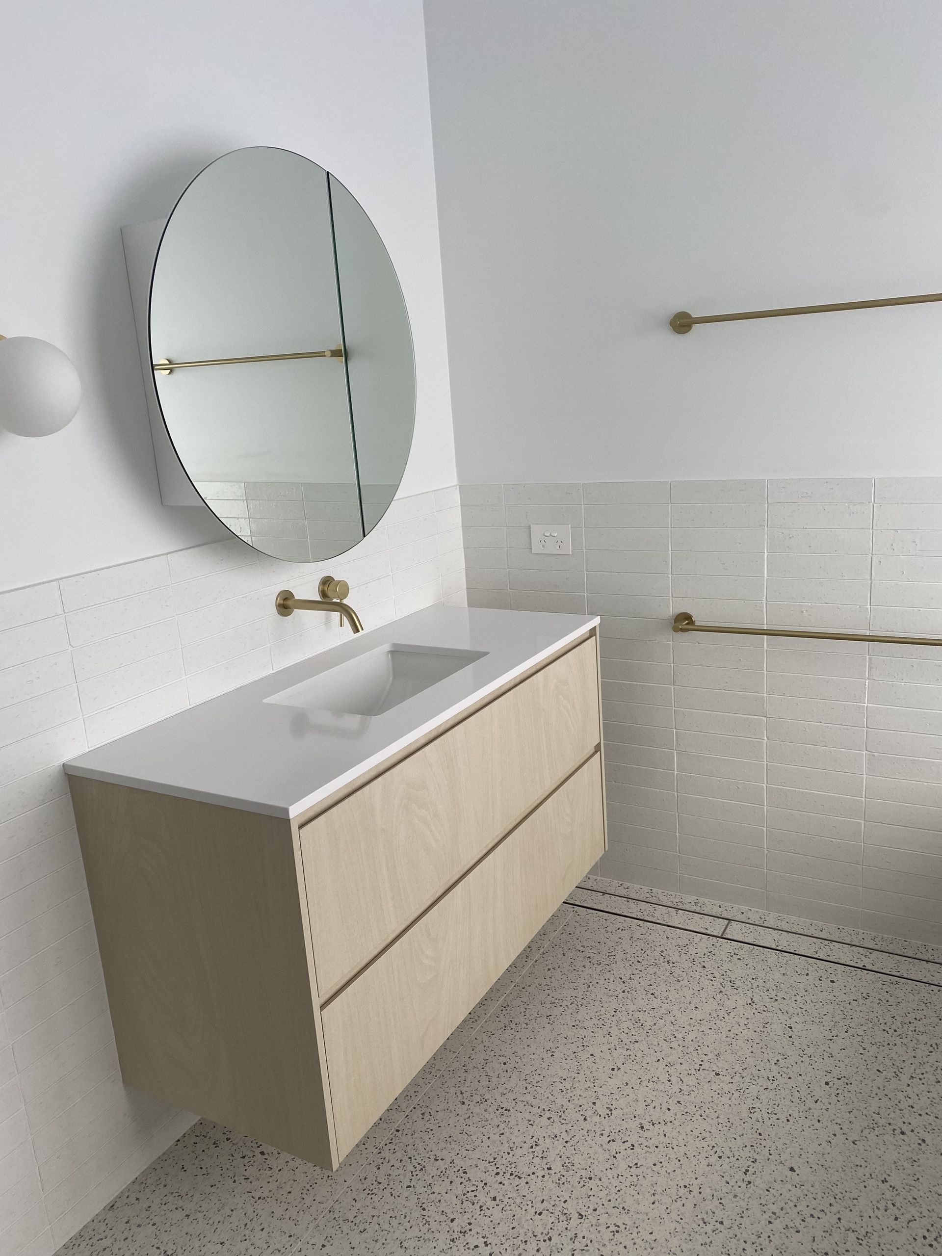 Light wood slat room divider. Vertical wooden slats attached to a top and bottom frame  — Barrington Coast Homes in Tallwoods, NSW