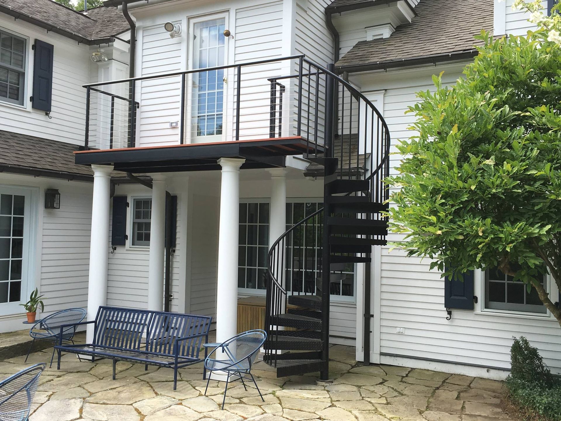 A spiral staircase outside of a home