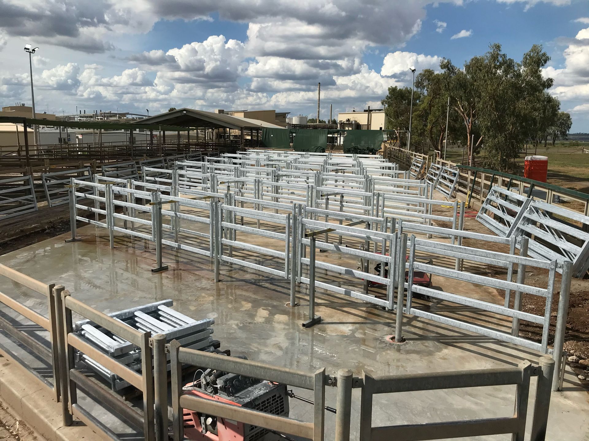 A bunch of fences are sitting on top of a concrete floor.
