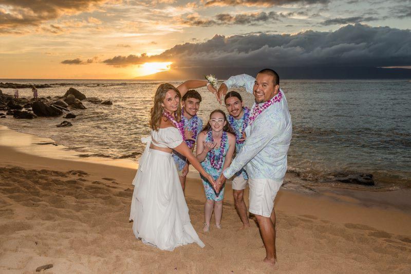 couple making heart with arms