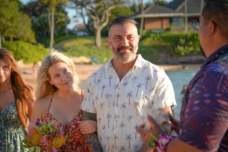 people on beach with trees in background