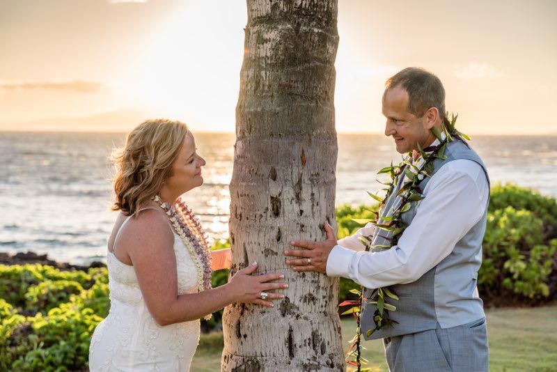 happy couple touching tree