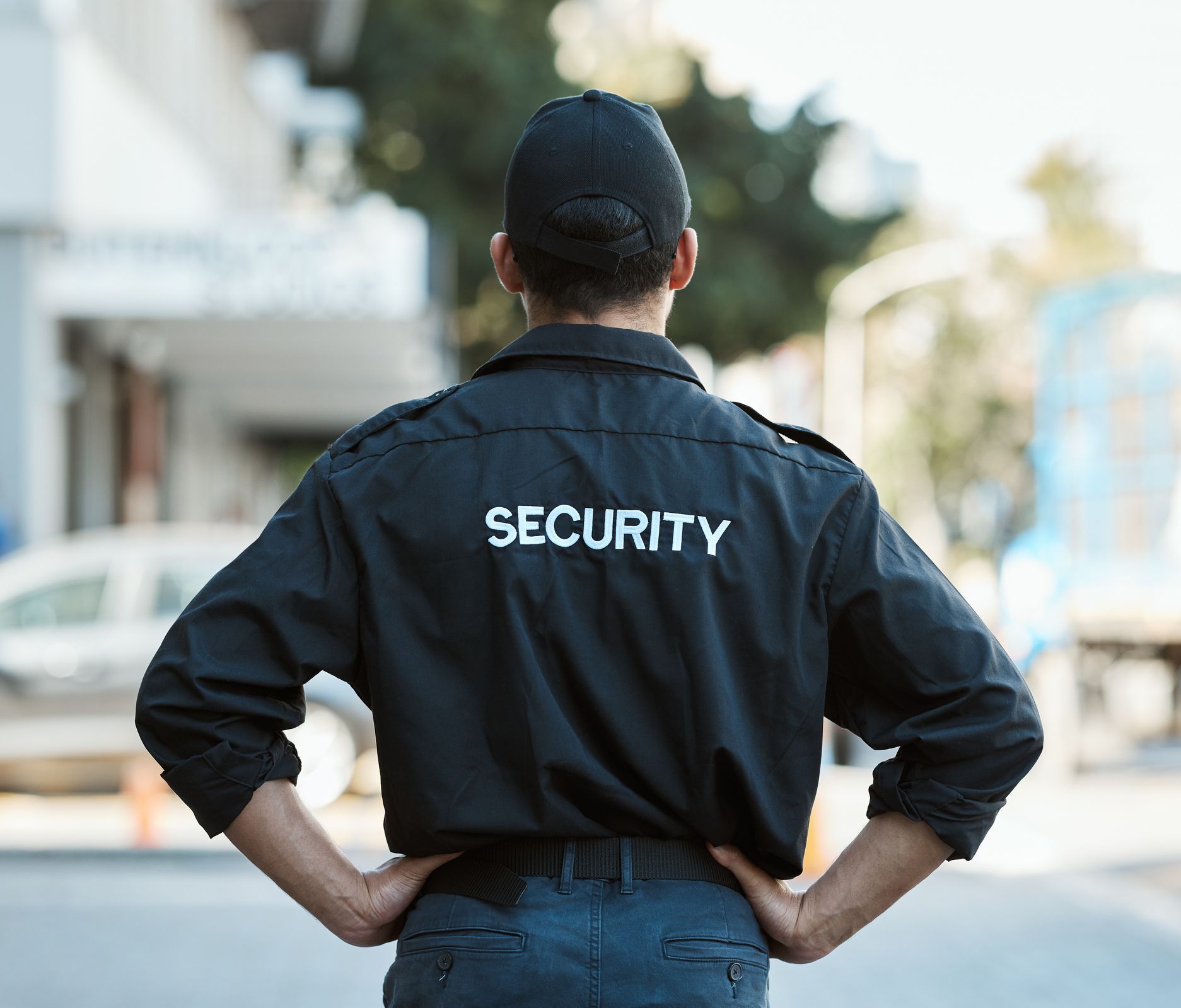 Security guard in black uniform with 