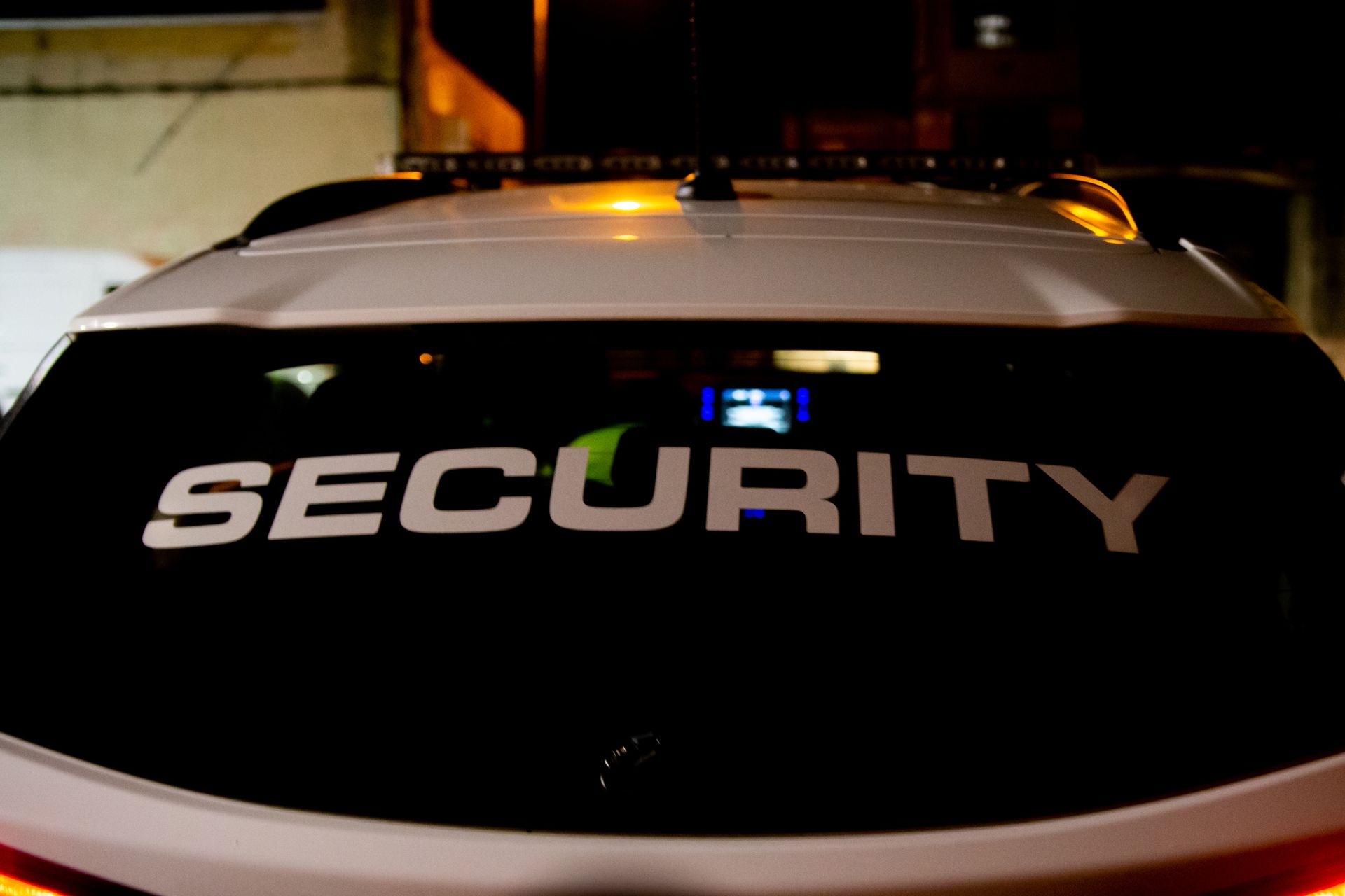 Back of a white security vehicle with 