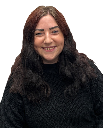 Woman with dark wavy hair smiling, wearing a black sweater.