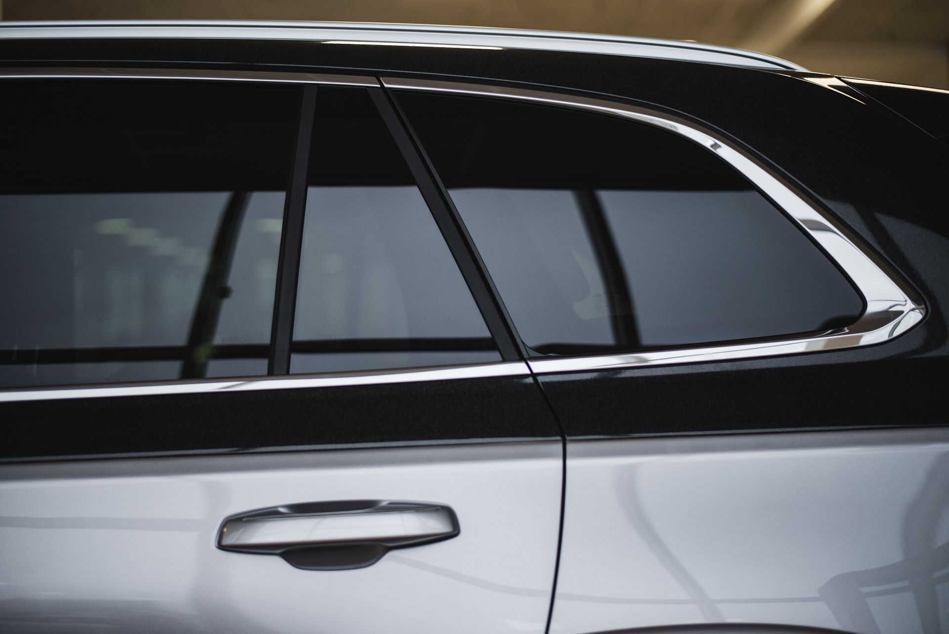 A close up of a car 's door and window