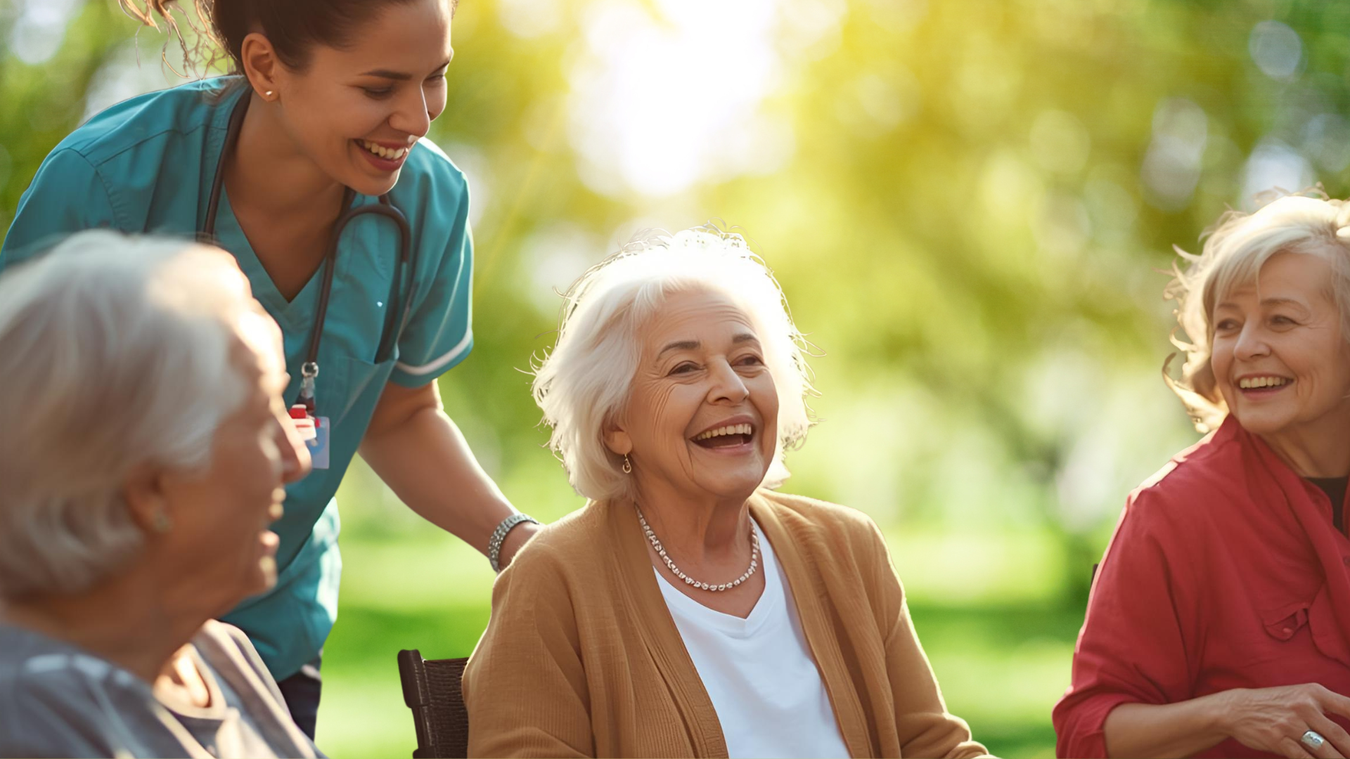 An older woman explains something to a nurse with a clipboard on a couch.