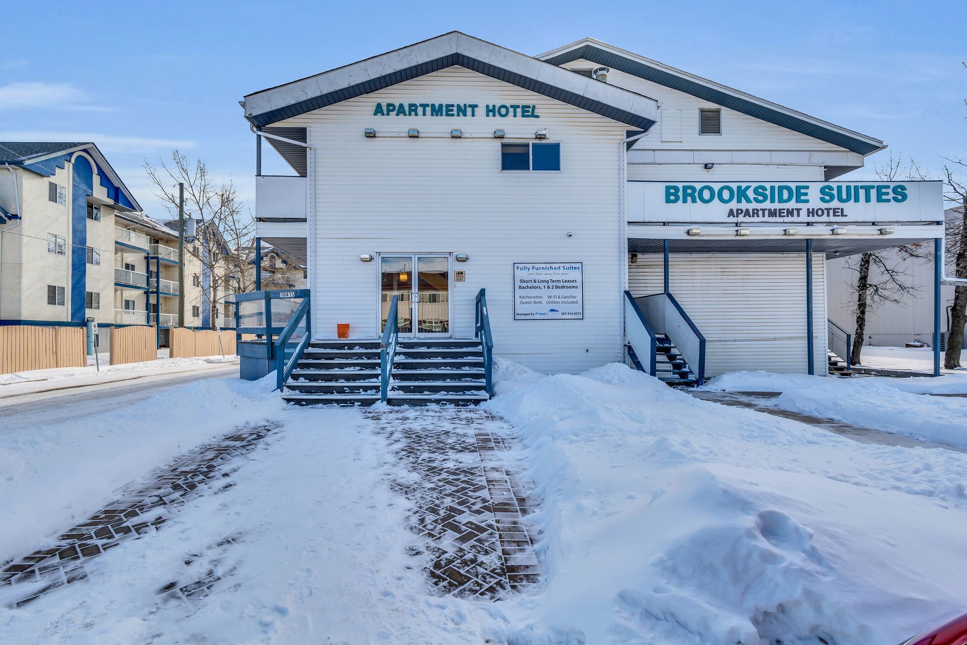 The brookside suites apartment hotel is covered in snow