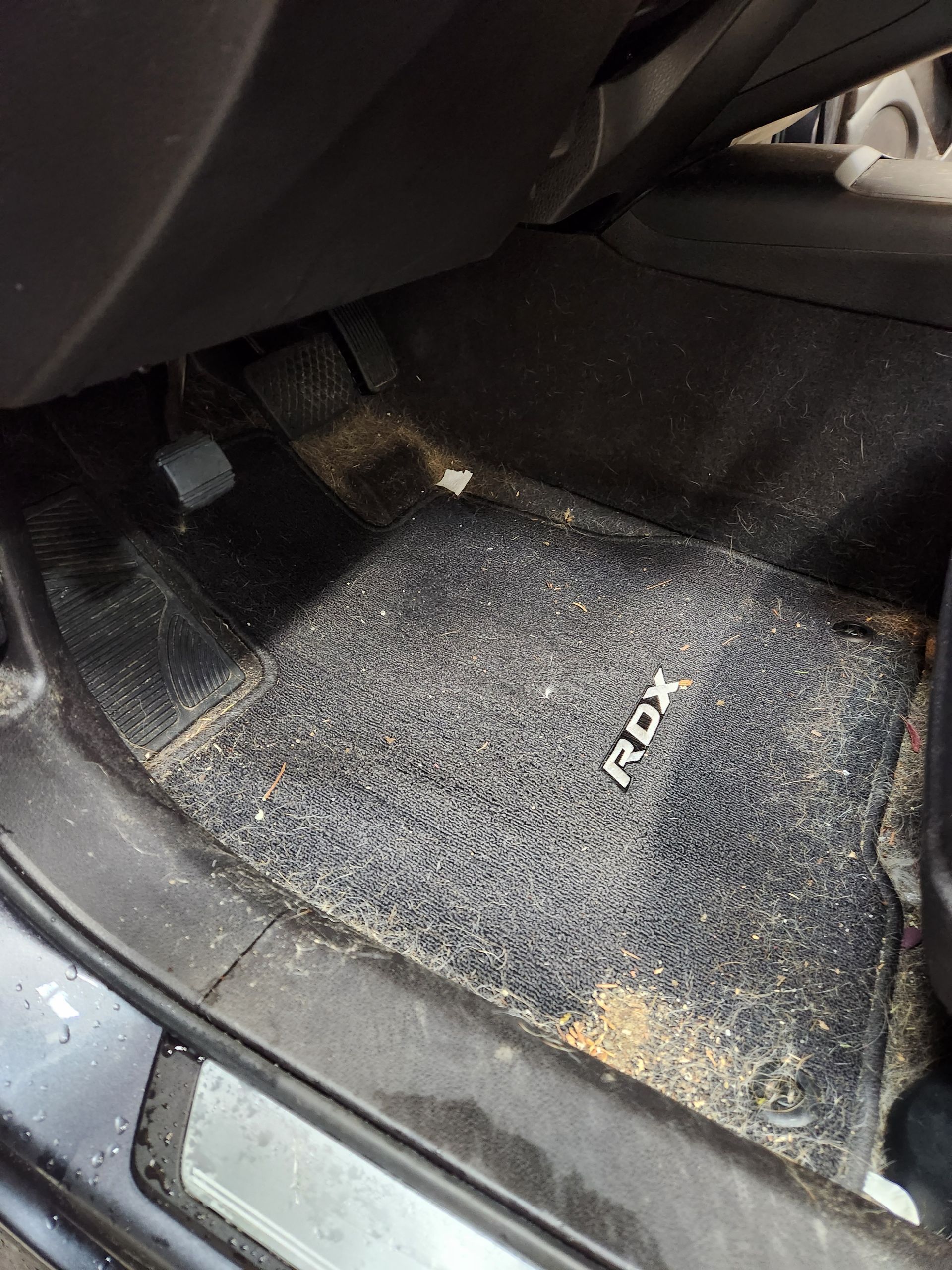 A dirty floor mat with the word rox on it