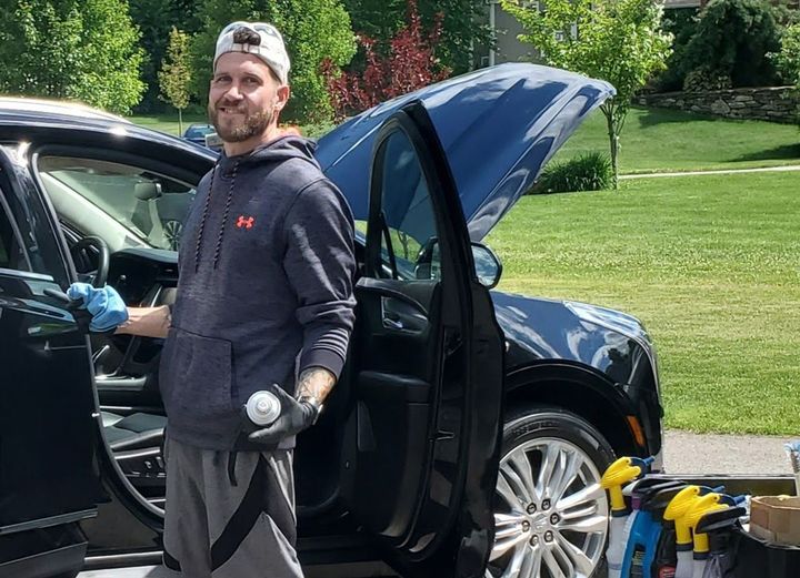 Professional Worker Doing Car Detailing