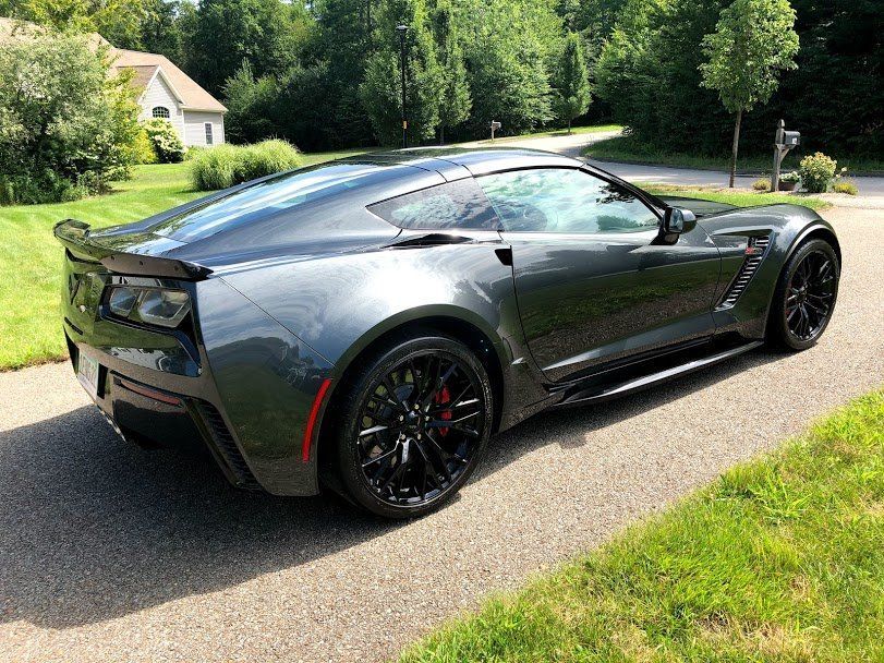 A gray corvette zr1 is parked on the side of the road.