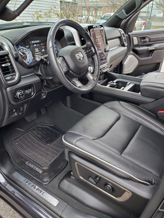 The interior of a ram 1500 truck with the door open.