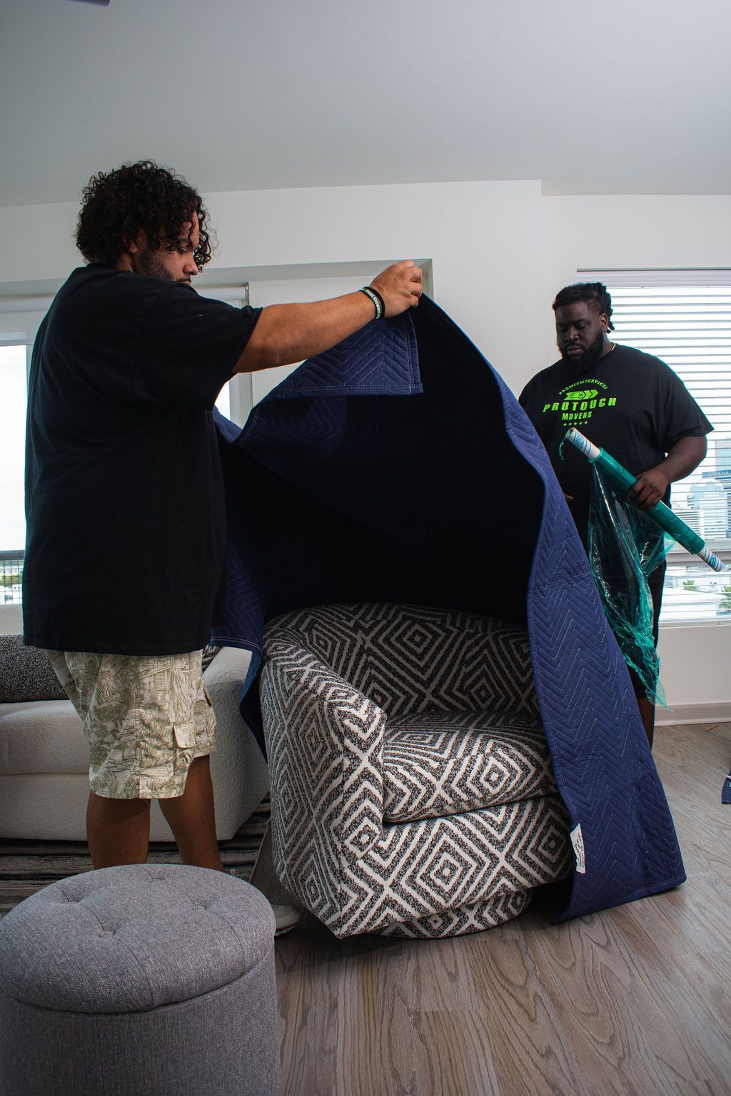 Moving Blanket with shrink wrap and sofa