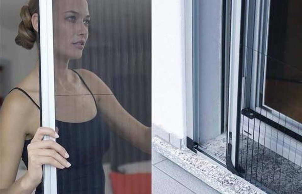 Una donna guarda fuori da una finestra con una zanzariera.