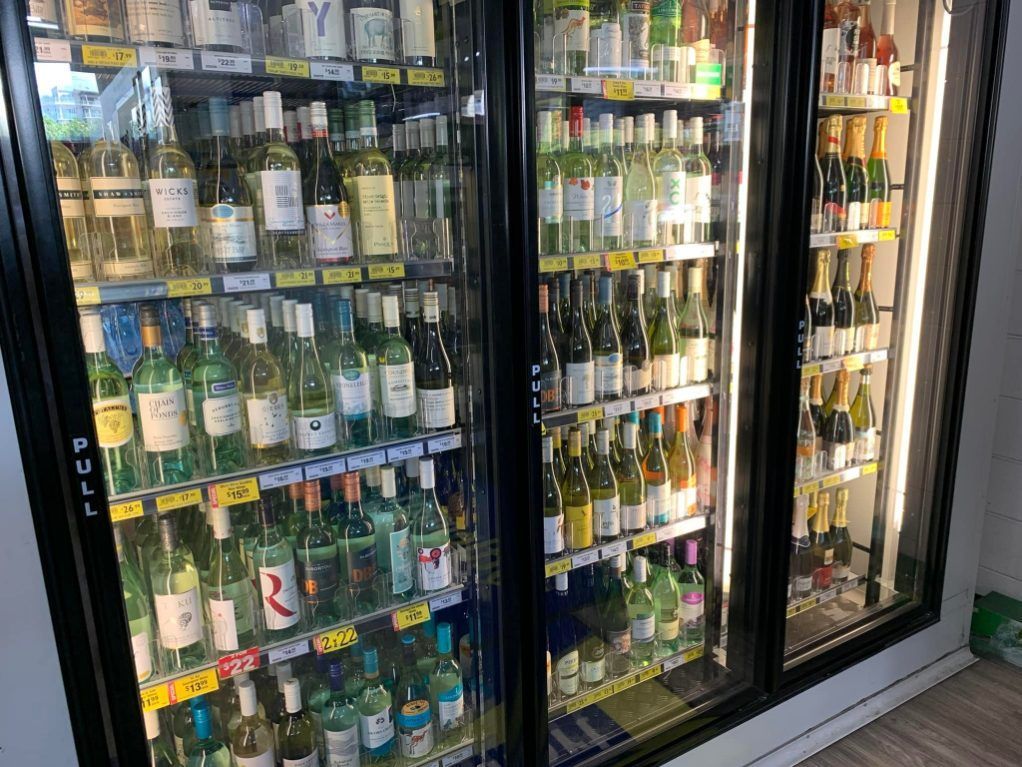Two Glasses Of Red Wine , A Bottle Of Wine Smith Street Supermarket In Darwin City, NT 