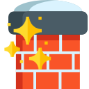 Red brick wall with dark gray top and yellow sparkles, like a sparkling fireplace or chimney.