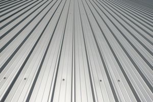 A close-up of a metal roof replacement