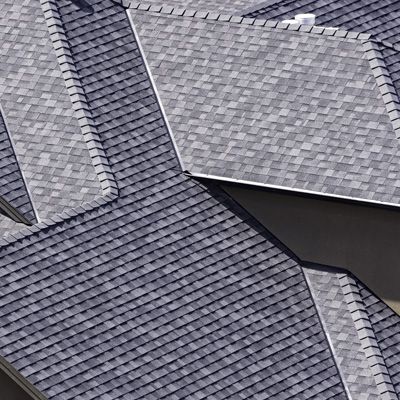 A close up of a roof with a lot of tiles on it.