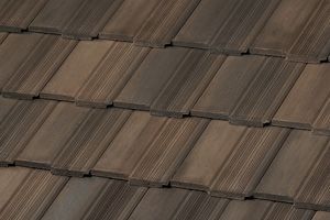 A row of concrete tiles on a roof.