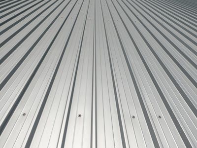 A close-up of a metal roof with a diagonal pattern.